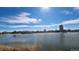 Scenic lake view with ducks and a high-rise building reflecting on a clear day at 3000 E 16Th Ave # 320, Denver, CO 80206