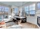 Inviting living area featuring a corner fireplace, window seat, and abundant natural light at 3000 E 16Th Ave # 320, Denver, CO 80206