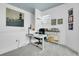 Home office with a white desk, gray carpet, a blue ceiling, and decor on the walls and desk at 3000 E 16Th Ave # 320, Denver, CO 80206