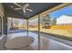 Covered patio featuring an outdoor ceiling fan overlooking a spacious backyard at 7208 S Xanthia Way, Centennial, CO 80112