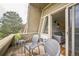 The balcony with seating has a nice view and is set up with string lights for nice evenings at 3240 Iris Ave # G409, Boulder, CO 80301
