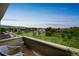 Balcony view features nice greenery, mountains, and blue skies with minimal clouds at 3240 Iris Ave # G409, Boulder, CO 80301