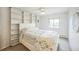 Inviting bedroom with built-in shelving and soft natural light from the window at 3240 Iris Ave # G409, Boulder, CO 80301