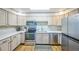 Kitchen featuring stainless steel appliances, light countertops, and wood flooring at 3240 Iris Ave # G409, Boulder, CO 80301