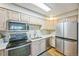 Kitchen boasts stainless steel appliances, light cabinets, and modern countertops at 3240 Iris Ave # G409, Boulder, CO 80301