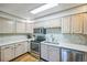 Bright kitchen featuring updated appliances and a modern backsplash at 3240 Iris Ave # G409, Boulder, CO 80301