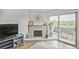 Living room area showcasing a fireplace and sliding glass doors to a balcony at 3240 Iris Ave # G409, Boulder, CO 80301