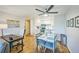 Bright living area features modern ceiling fan and open layout to the kitchen with stainless appliances at 3240 Iris Ave # G409, Boulder, CO 80301