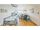 Cozy living room with wood flooring, fireplace, access to balcony, and a dedicated workspace at 3240 Iris Ave # G409, Boulder, CO 80301