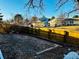 View of a fenced backyard with potential for gardening or landscaping at 4558 S Laredo St, Aurora, CO 80015