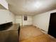 Unfinished basement with dark door and metal workbench providing potential for storage or customization at 4558 S Laredo St, Aurora, CO 80015