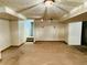 This finished basement includes an open area with neutral walls and ceiling lights at 4558 S Laredo St, Aurora, CO 80015