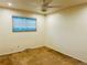 This is a bedroom with a window and a ceiling fan at 4558 S Laredo St, Aurora, CO 80015