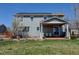 This home features a covered patio, solar panels, and well-maintained green space at 952 Eaglestone Dr, Castle Rock, CO 80104