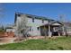 Two-story home with solar panels and a covered patio, complemented by a beautifully landscaped backyard at 952 Eaglestone Dr, Castle Rock, CO 80104