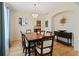 Stylish dining room with hardwood floors, elegant chandelier, and an adjacent living space at 952 Eaglestone Dr, Castle Rock, CO 80104