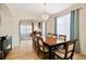 Open dining area with hardwood floors, a chandelier, and view of living space, perfect for entertaining at 952 Eaglestone Dr, Castle Rock, CO 80104