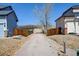 Long gravel driveway, bordered by wooden fences, leading to a private and secluded property at 952 Eaglestone Dr, Castle Rock, CO 80104