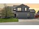 Charming two-story home with a well-maintained lawn and a three-car garage at 952 Eaglestone Dr, Castle Rock, CO 80104