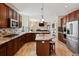 Full kitchen with wood cabinets, stainless steel appliances and granite countertops at 952 Eaglestone Dr, Castle Rock, CO 80104