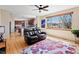 Open concept living space with hardwood flooring, large windows, and view to outside at 952 Eaglestone Dr, Castle Rock, CO 80104