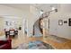 Open-concept living space with a staircase, hardwood floors, dining area and a chandelier at 952 Eaglestone Dr, Castle Rock, CO 80104