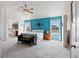 Bright primary bedroom offers beautiful accent wall and an ensuite bathroom with jetted tub at 952 Eaglestone Dr, Castle Rock, CO 80104