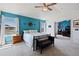 Bright primary bedroom offers beautiful accent wall and large windows with lots of natural light at 952 Eaglestone Dr, Castle Rock, CO 80104
