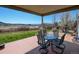 Covered patio with outdoor seating and a beautiful view of the surrounding landscape at 952 Eaglestone Dr, Castle Rock, CO 80104