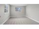 Neutral bedroom featuring carpet flooring and a bright window, perfect for relaxation at 439 W 91St Cir, Thornton, CO 80260