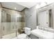 A stylish bathroom with gray walls and a modern shower at 12092 S Great Plain Ct, Parker, CO 80134