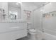 A pristine bathroom with a modern vanity, toilet, and glass-enclosed shower at 12092 S Great Plain Ct, Parker, CO 80134