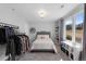 This is a cozy bedroom with a bed and a large window and closet at 12092 S Great Plain Ct, Parker, CO 80134