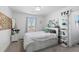 Bedroom featuring a large window and modern decorations at 12092 S Great Plain Ct, Parker, CO 80134