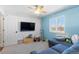 Bedroom with a wall mounted tv and large windows at 12092 S Great Plain Ct, Parker, CO 80134