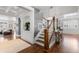 Elegant entryway with hardwood floors and staircase at 12092 S Great Plain Ct, Parker, CO 80134