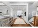 Inviting foyer with hardwood floors, decorative sideboard, and decorative coffered ceilings at 12092 S Great Plain Ct, Parker, CO 80134