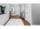 Inviting foyer with hardwood floors, white trim, and stylish decor at 12092 S Great Plain Ct, Parker, CO 80134