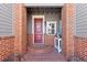 Charming front porch with brick columns and a welcoming entrance at 12092 S Great Plain Ct, Parker, CO 80134