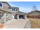 Attached garage with storage space and a large driveway at 12092 S Great Plain Ct, Parker, CO 80134