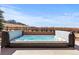 Relaxing hot tub surrounded by a brick wall and scenic views at 12092 S Great Plain Ct, Parker, CO 80134