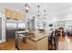Modern kitchen with a large island and stainless steel appliances at 12092 S Great Plain Ct, Parker, CO 80134