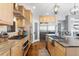 Well-appointed kitchen with a stainless steel refrigerator and stainless steel appliances at 12092 S Great Plain Ct, Parker, CO 80134