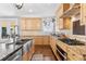 Elegant kitchen featuring stainless steel appliances and granite countertops at 12092 S Great Plain Ct, Parker, CO 80134