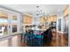 Gourmet kitchen with stainless steel appliances, a spacious island, and an outdoor view at 12092 S Great Plain Ct, Parker, CO 80134