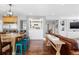 Open concept living area with hardwood floors and stylish decor at 12092 S Great Plain Ct, Parker, CO 80134