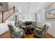 Cozy living room with a fireplace, coffered ceiling, and comfortable seating at 12092 S Great Plain Ct, Parker, CO 80134
