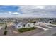 Spacious single-story home surrounded by a lush green lawn and neighborhood views at 16122 Emporia Way, Brighton, CO 80602