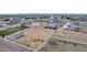 Aerial view of a horse property with arena, stalls, and neighboring homes at 16122 Emporia Way, Brighton, CO 80602