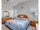 Bright bedroom featuring a wood bed frame, matching dresser, and sunlit windows at 16122 Emporia Way, Brighton, CO 80602